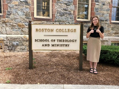 Nicole Bucheck standing in front of  Boston College sign